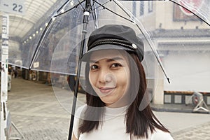 Attractive beautiful lady hold an umbrella.